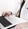 close-up of a doctor typing
